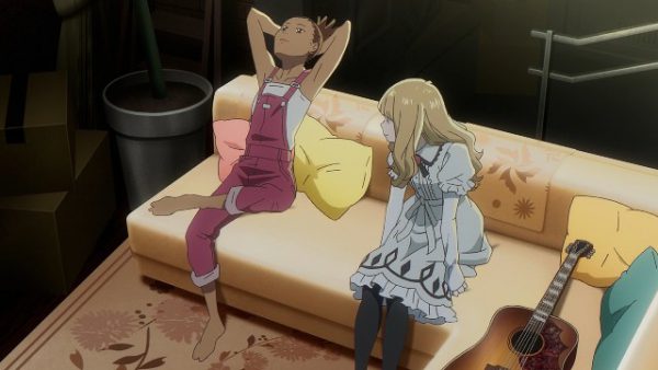 Carole & Tuesday relax on a sofa